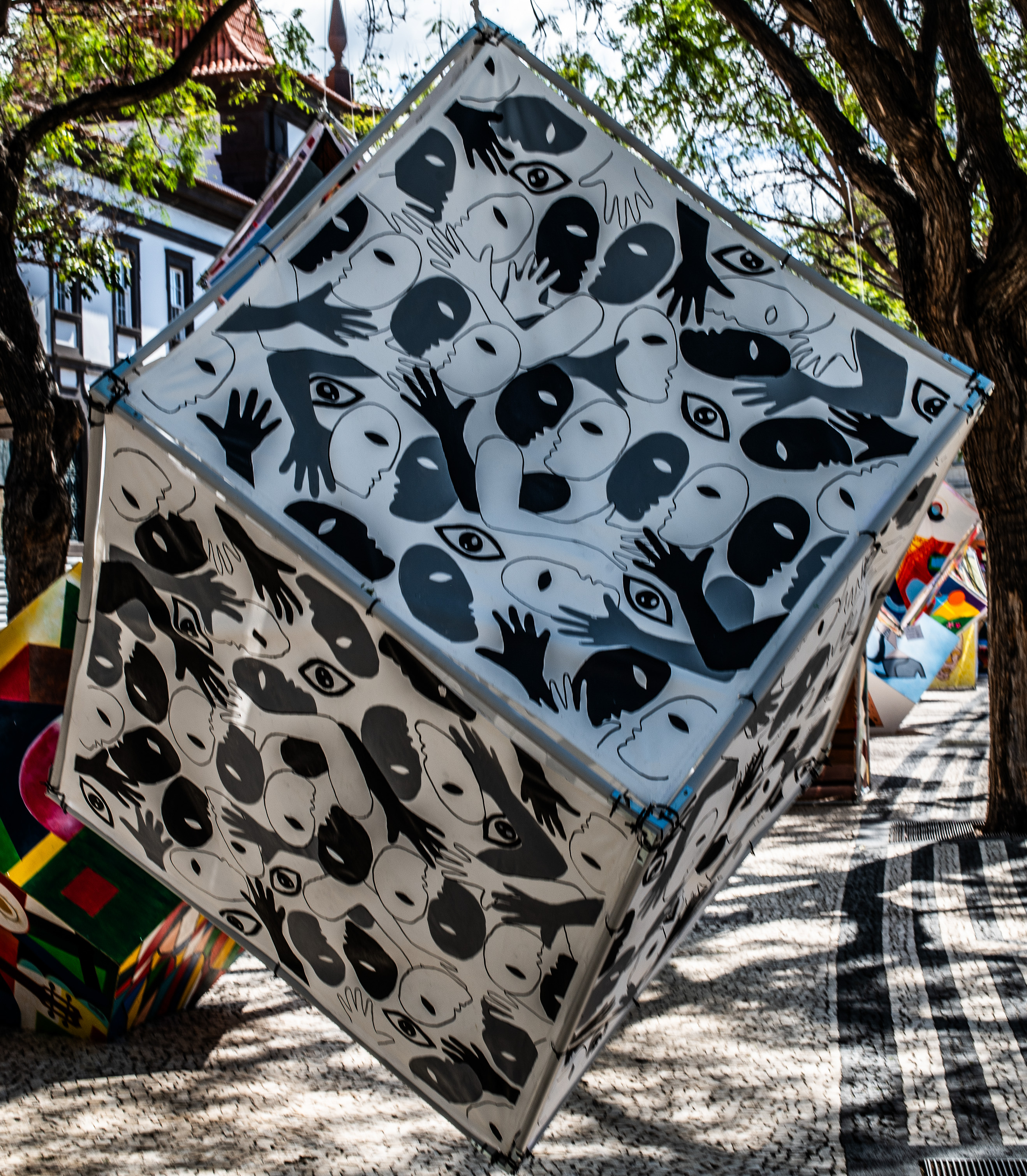 black, abstract, cartoon-like faces