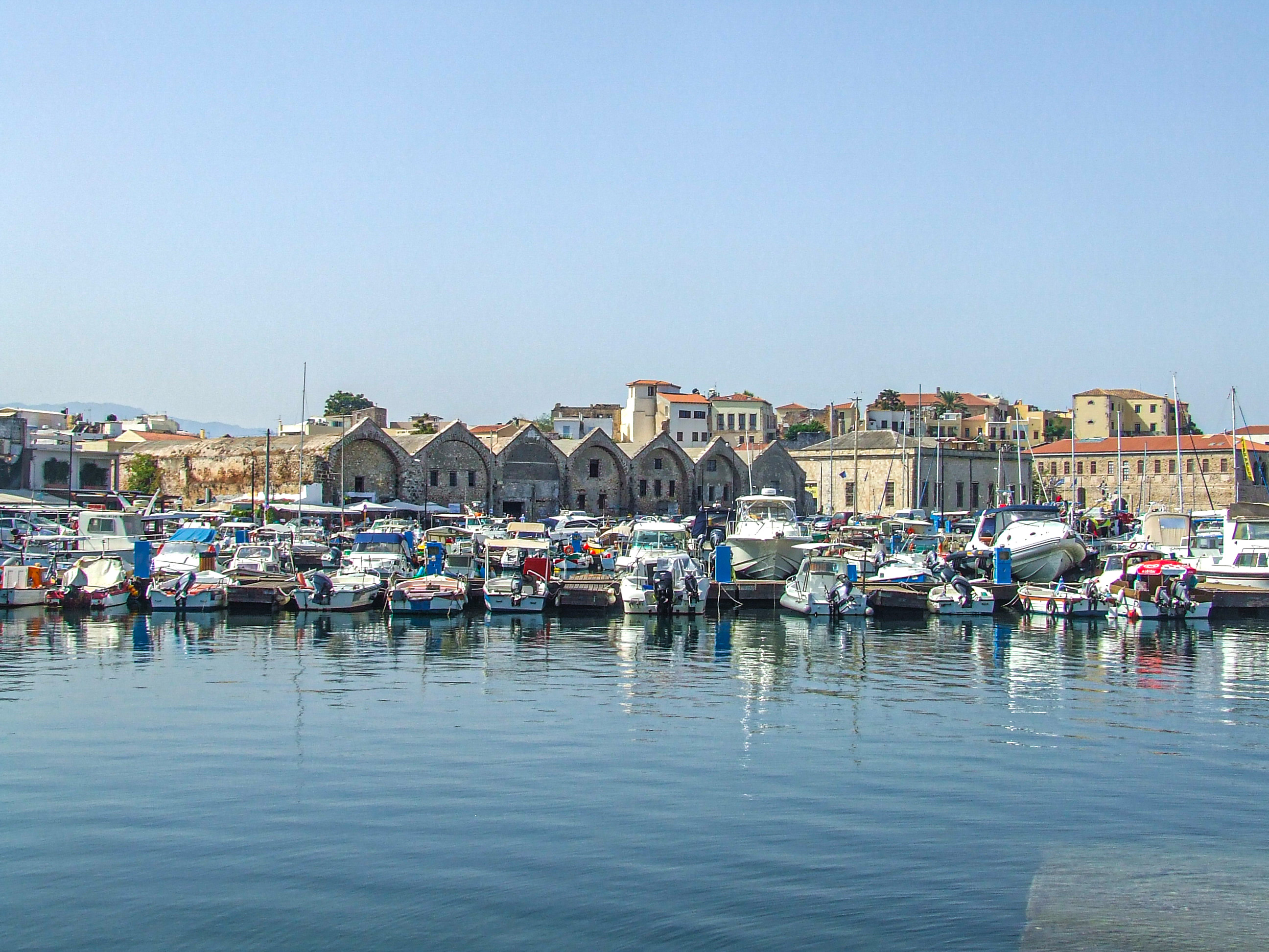 boats docked in calm waters.