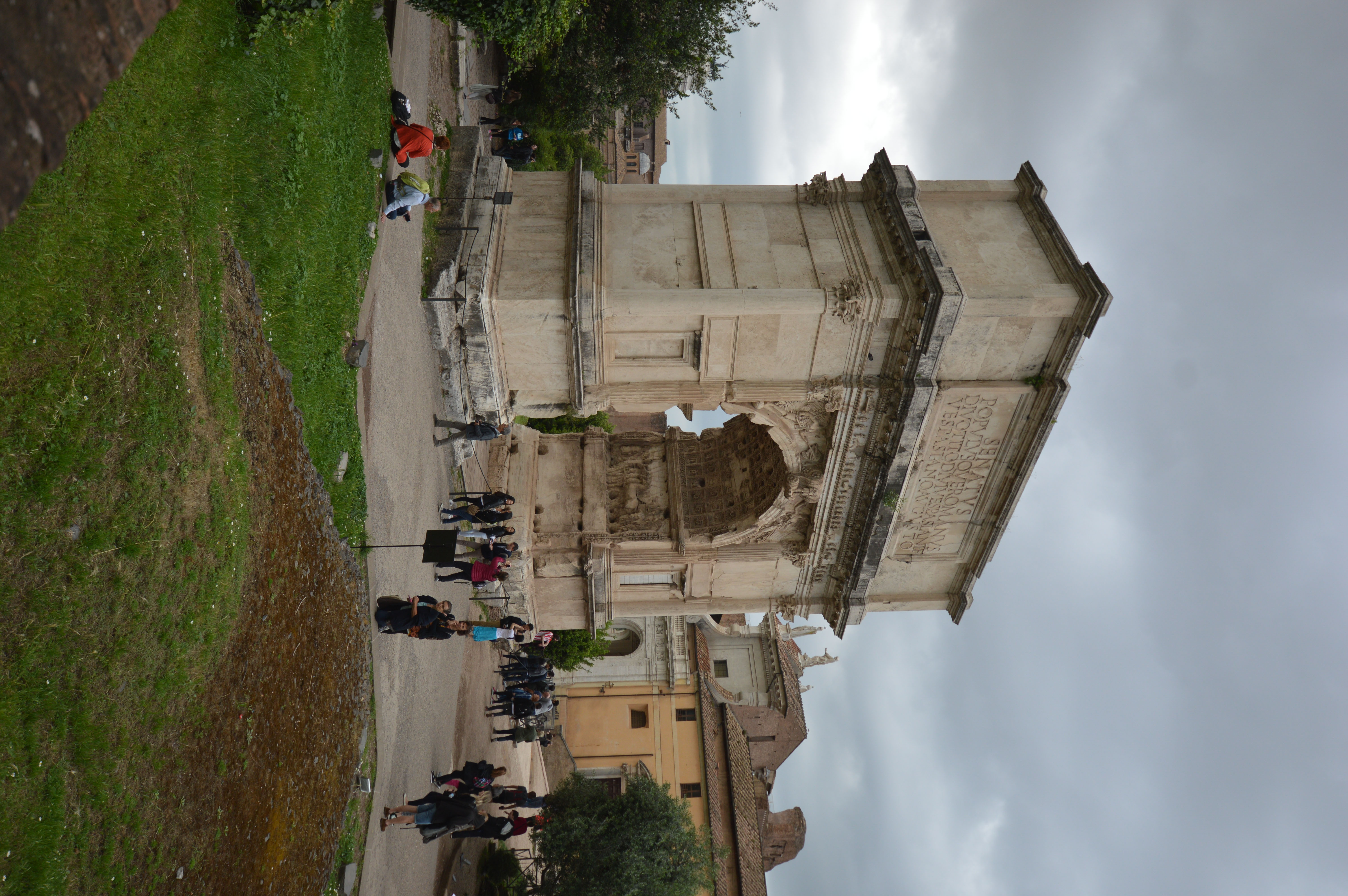 Arch of Titus, with a large crowd of people walking through it