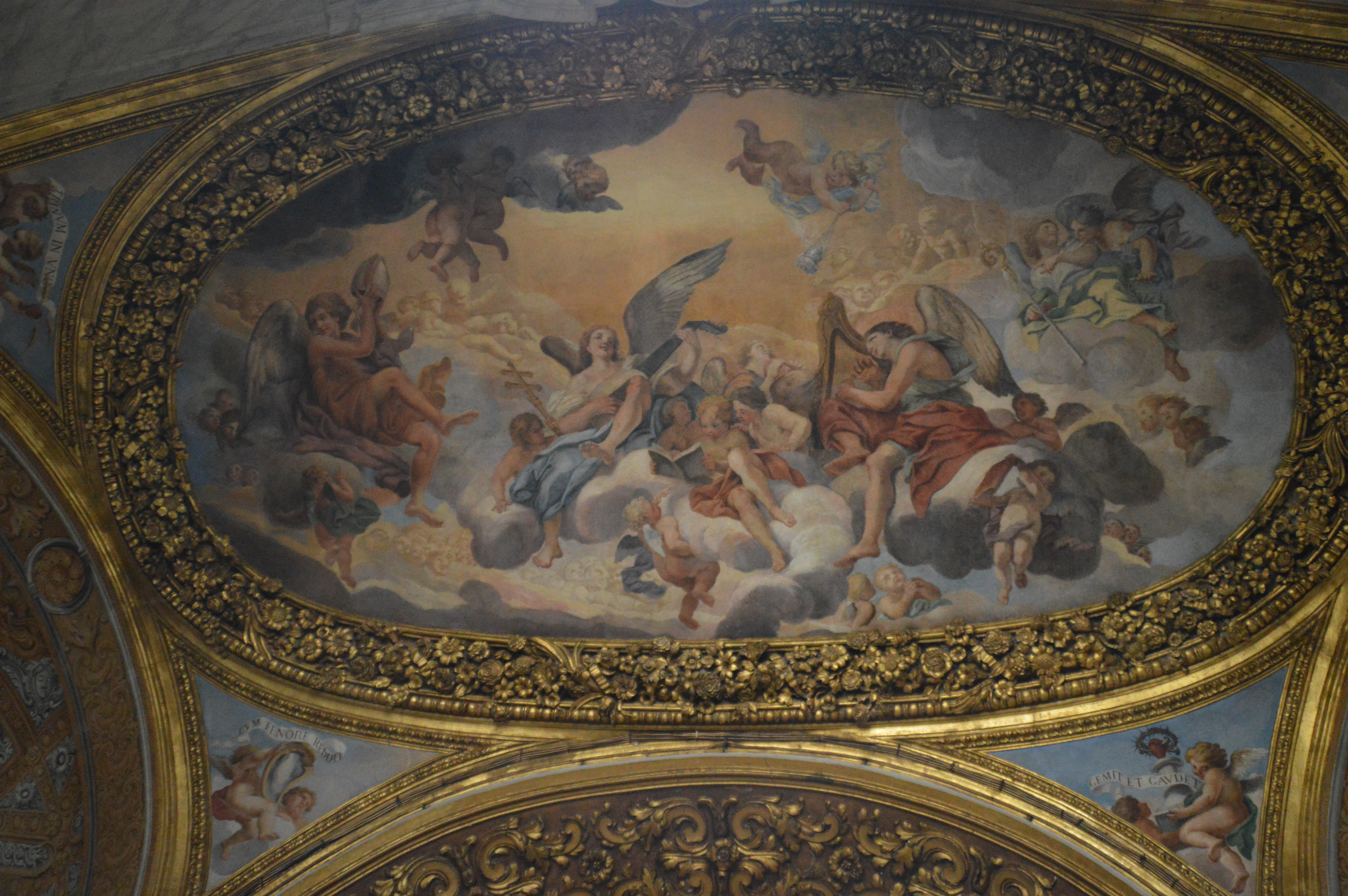 ornate ceiling fresco featuring a multitude of cherubs and angels